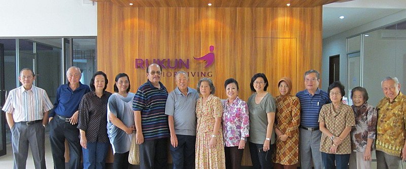 Group of seniors posing together at RUKUN Senior Living