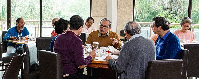 Older adults dining and socializing together