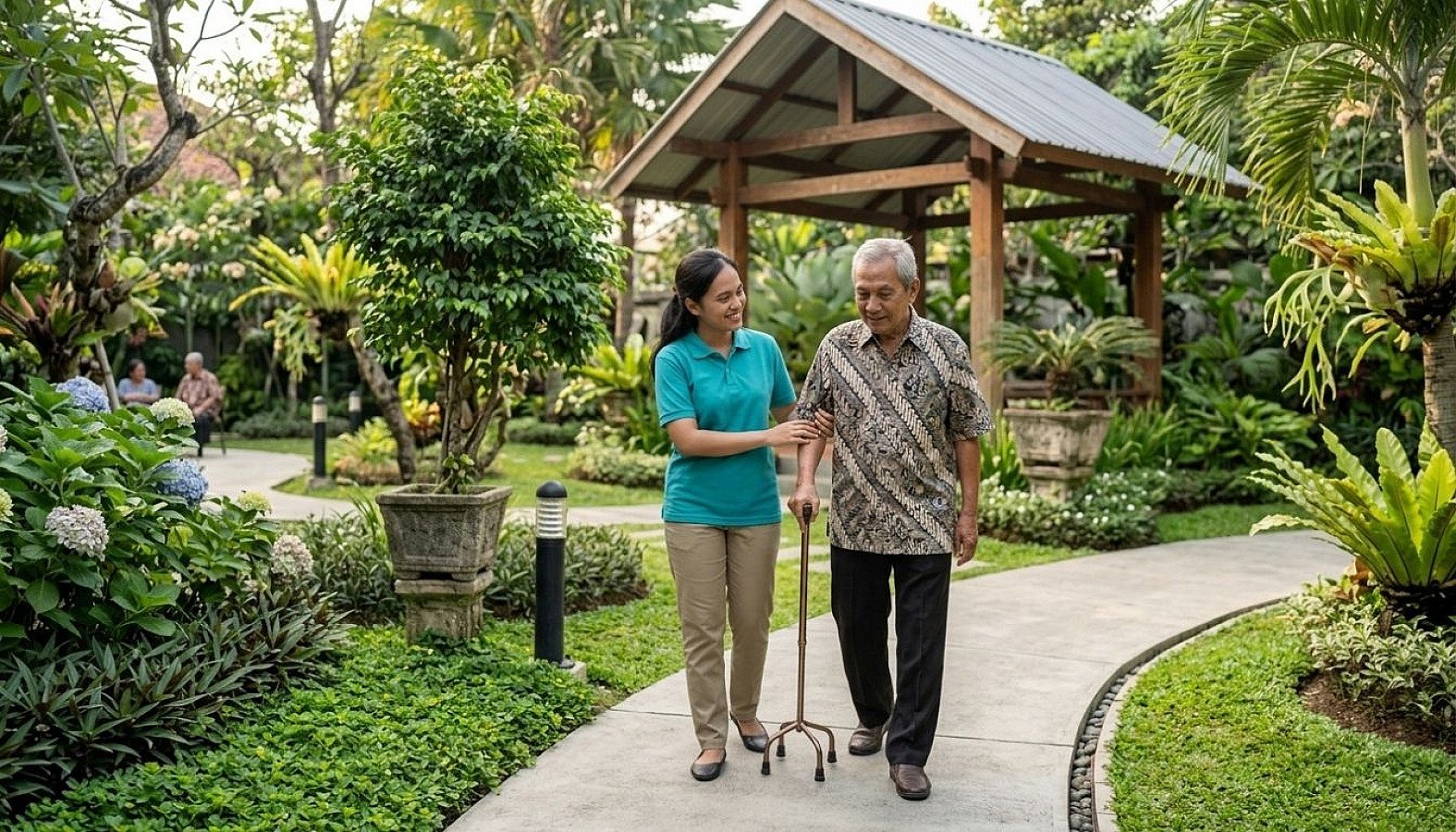 Professional caregiver assisting an elderly resident during an outdoor walk in a serene senior living garden